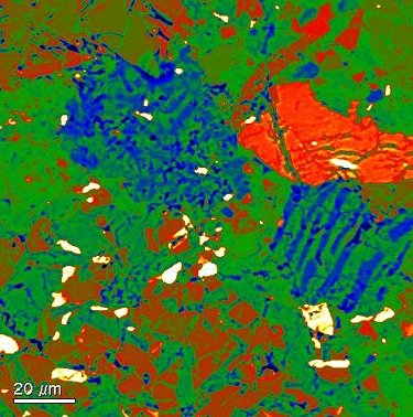 Granophyric intergrowth clasts (blue and green), pyroxene (red) and troilite+metal (white).