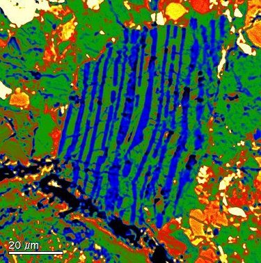“Granophyric” clast composed of ribbon-like intergrowth of silica (blue) and K-feldspar (green).