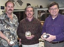 Adam Hupé (left), Dr. Anthony Irving and Dr. Donald Brownlee holding slices of NWA 482.